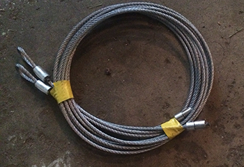 Garage door pulley system in Lubbock showing area where broken cable was replaced.