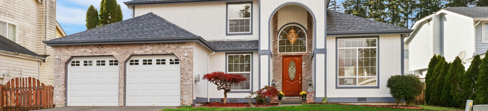 Beautiful residential home with professional garage door installation showcasing quality workmanship in Savage Minnesota