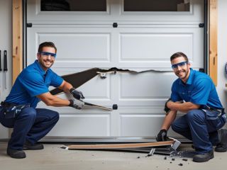 Technicians Repairing a Damaged Garage Door Panel in Savage, MN Two professional technicians in blue uniforms repairing a broken white garage door panel inside a Savage, MN garage